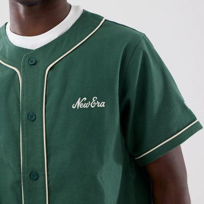 The model is wearing this New Era Baseball Jersey in dark green. 5