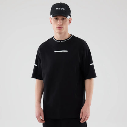 The model is wearing this New Era Tech T-Shirt in black. 1