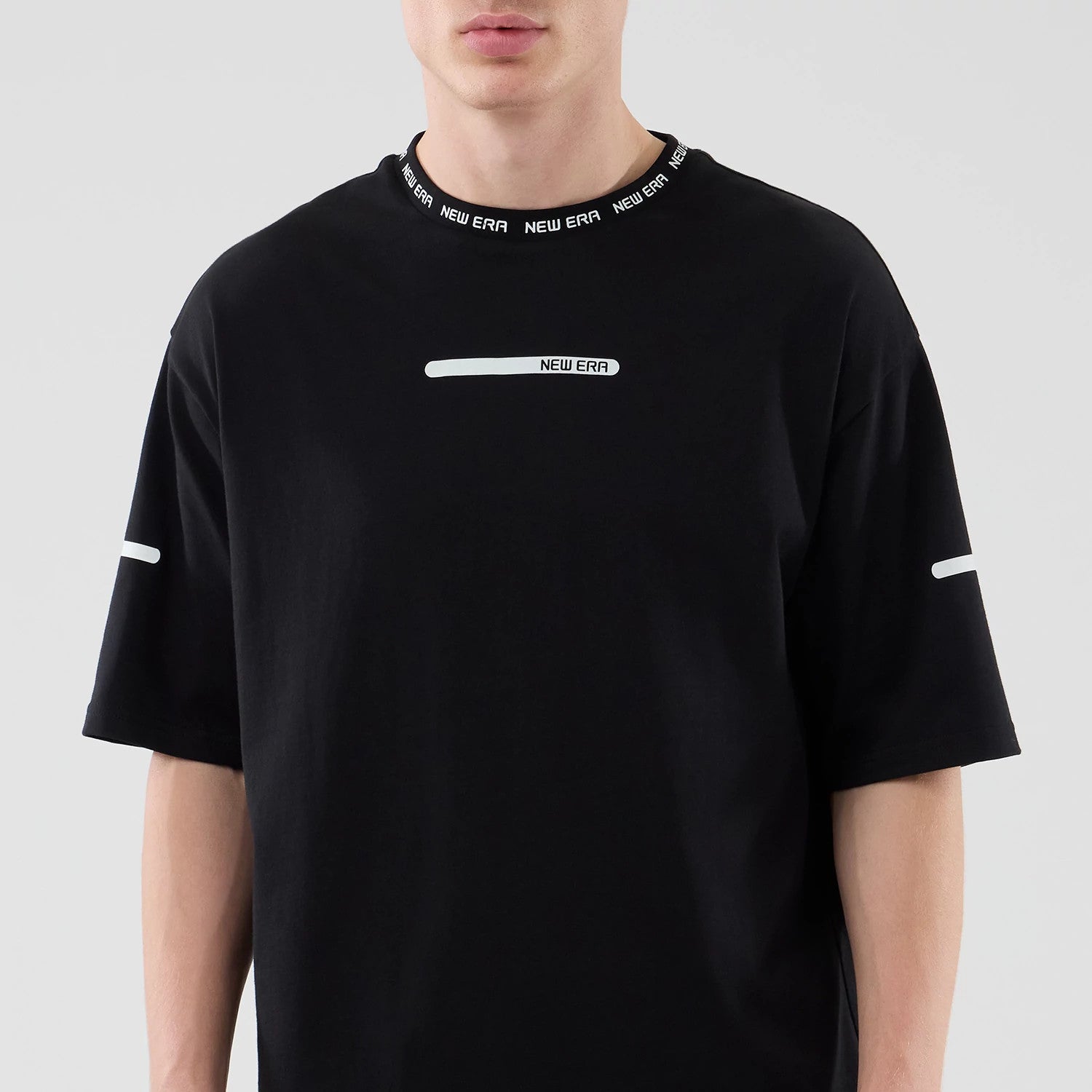 The model is wearing this New Era Tech T-Shirt in black. 3