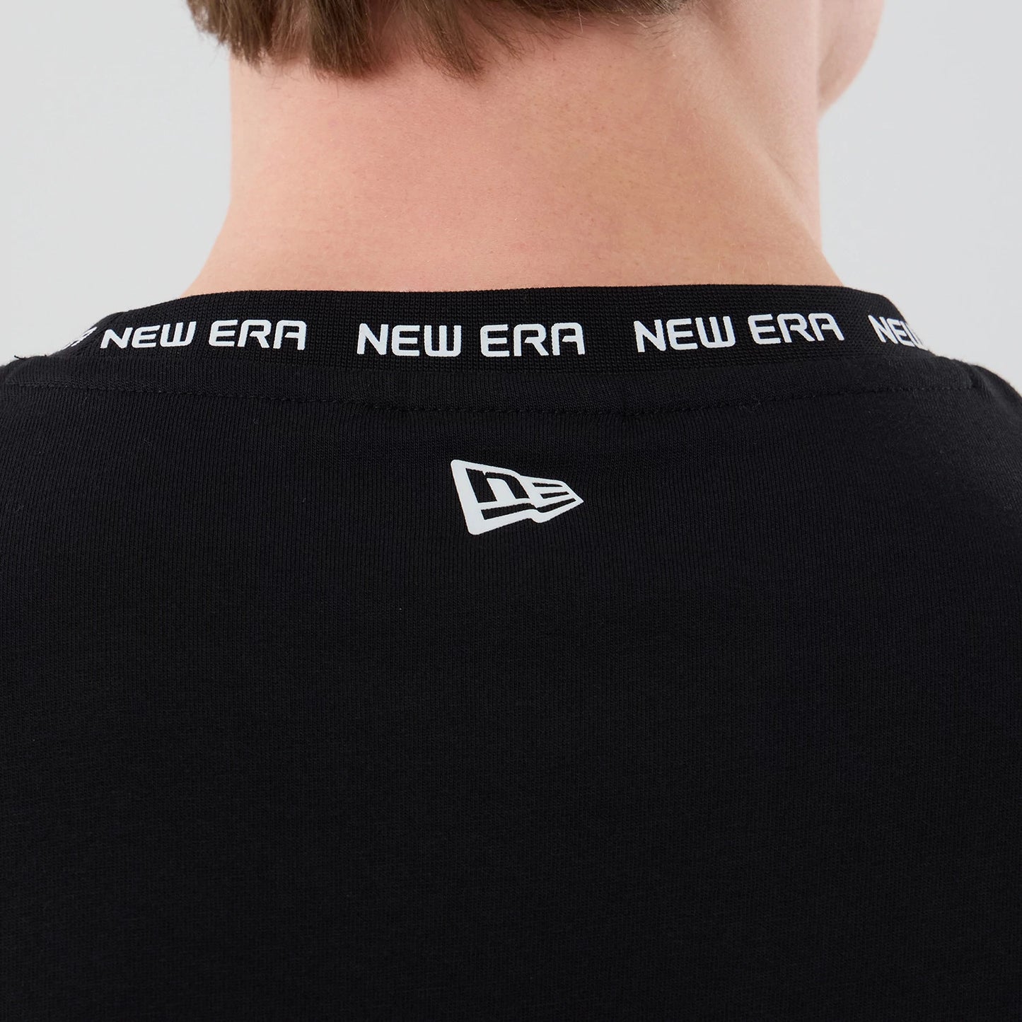 The model is wearing this New Era Tech T-Shirt in black. 5