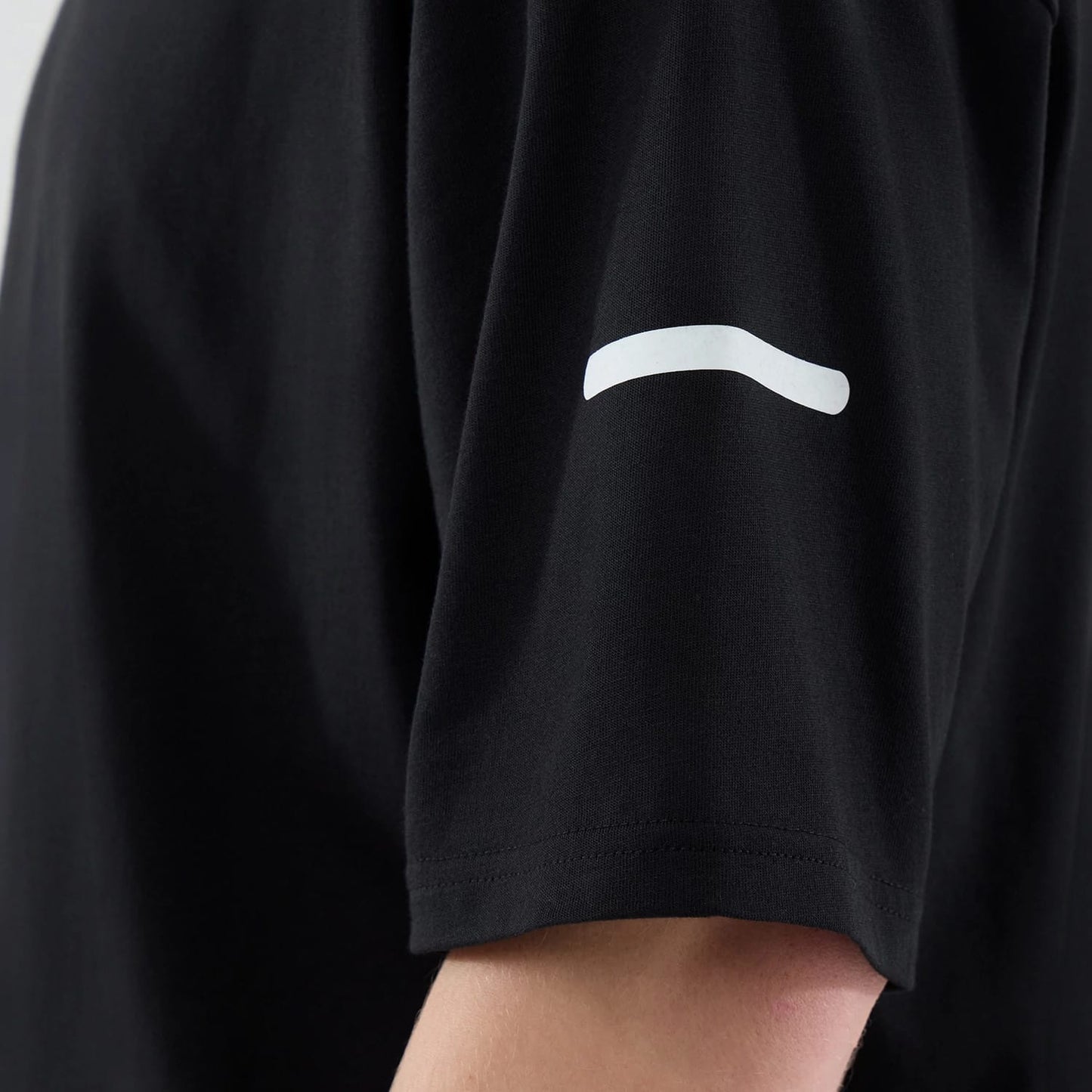 The model is wearing this New Era Tech T-Shirt in black. 6
