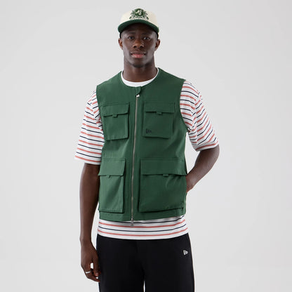 The model is wearing this New Era Utility Vest in dark green. 3