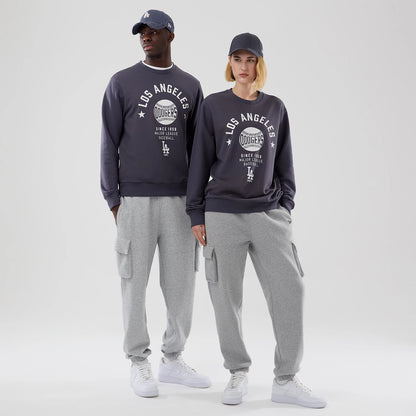The model is wearing this MLB Graphic LA Dodgers Oversized Crew Neck Sweater in grey. 1