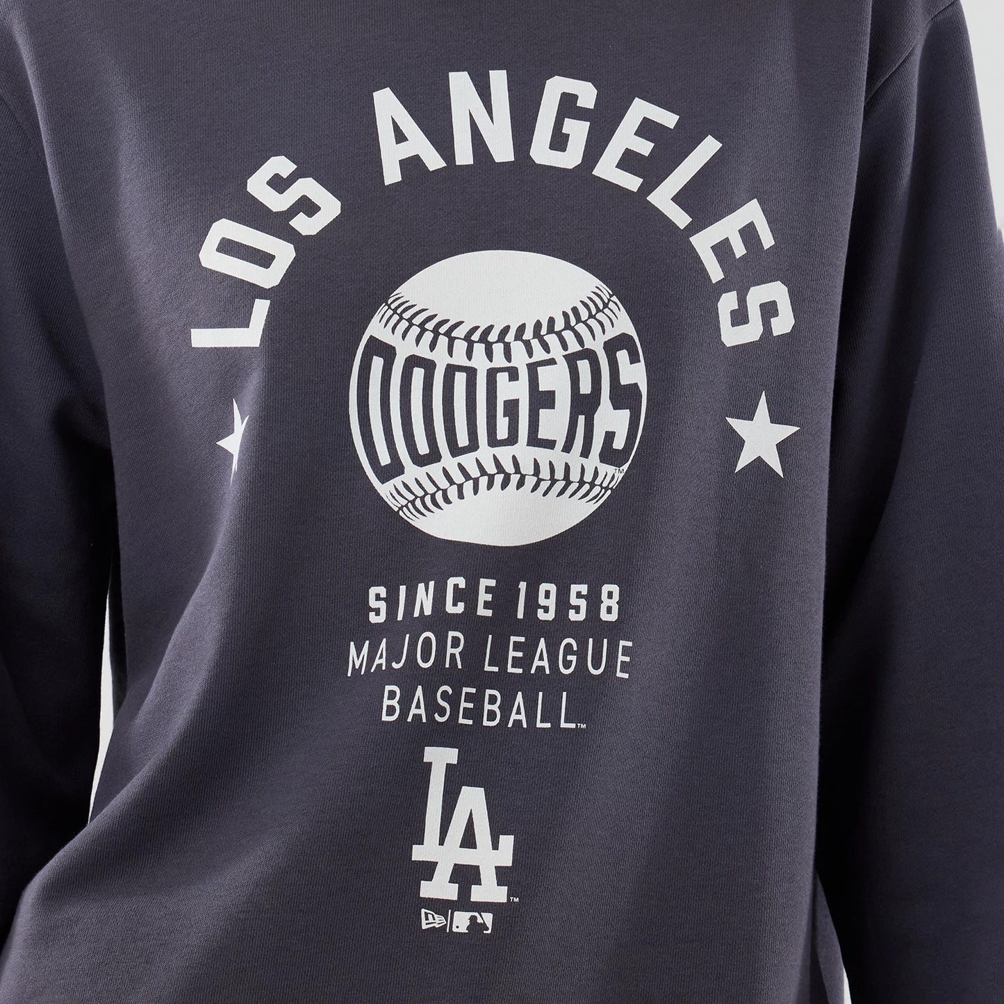 The model is wearing this MLB Graphic LA Dodgers Oversized Crew Neck Sweater in grey. 6