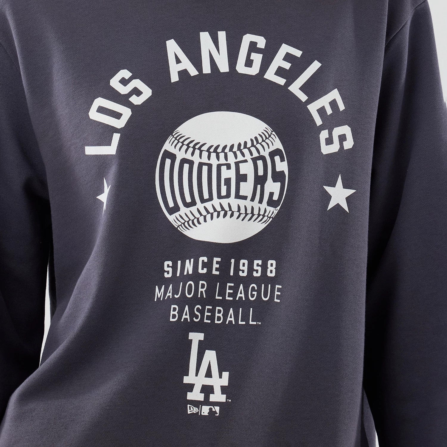 The model is wearing this MLB Graphic LA Dodgers Oversized Crew Neck Sweater in grey. 6
