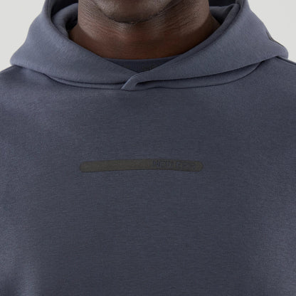 The model is wearing this New Era Tech Oversized Pullover Hoodie in grey. 4