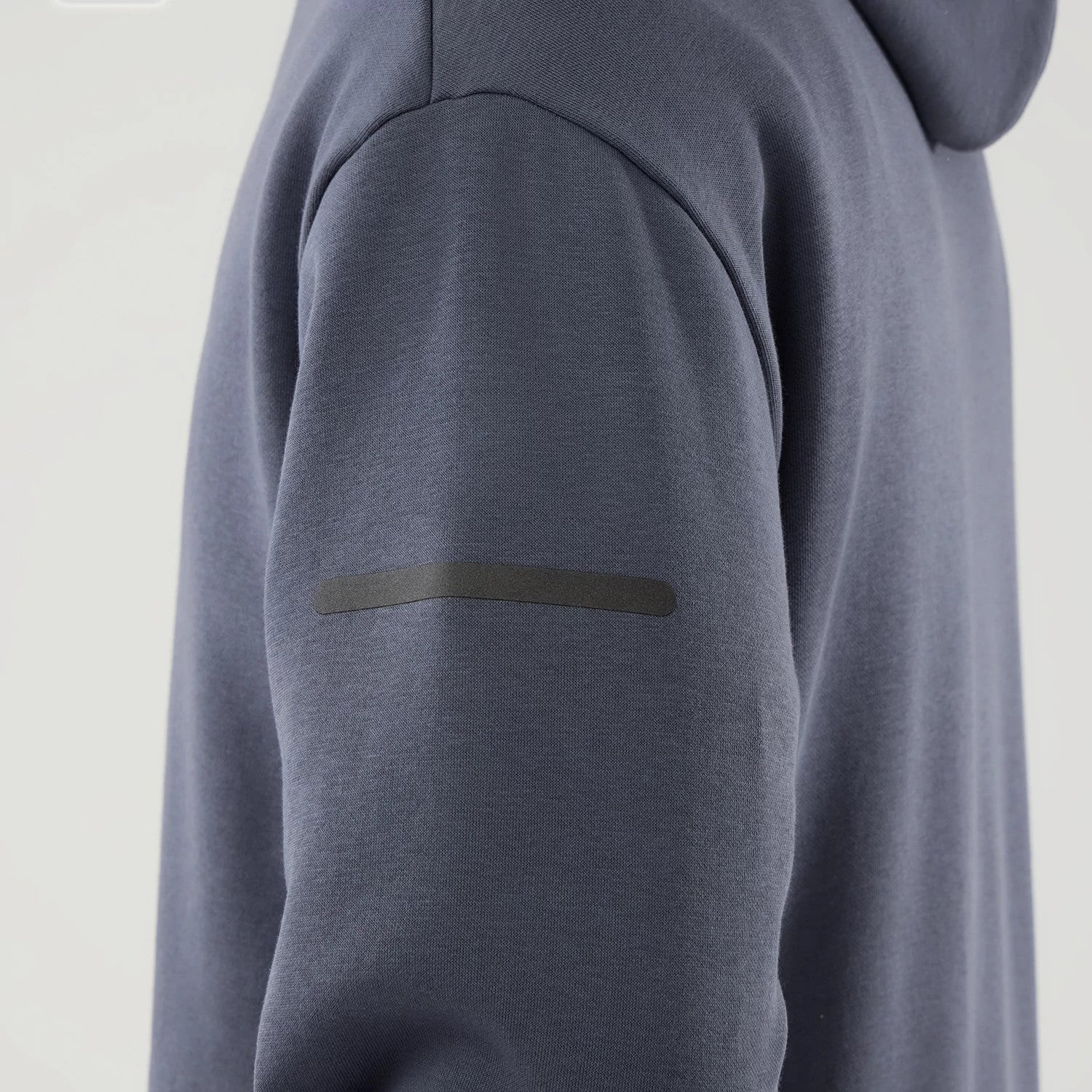 The model is wearing this New Era Tech Oversized Pullover Hoodie in grey. 6