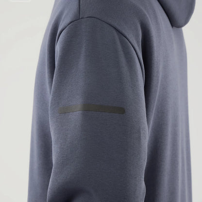 The model is wearing this New Era Tech Oversized Pullover Hoodie in grey. 6