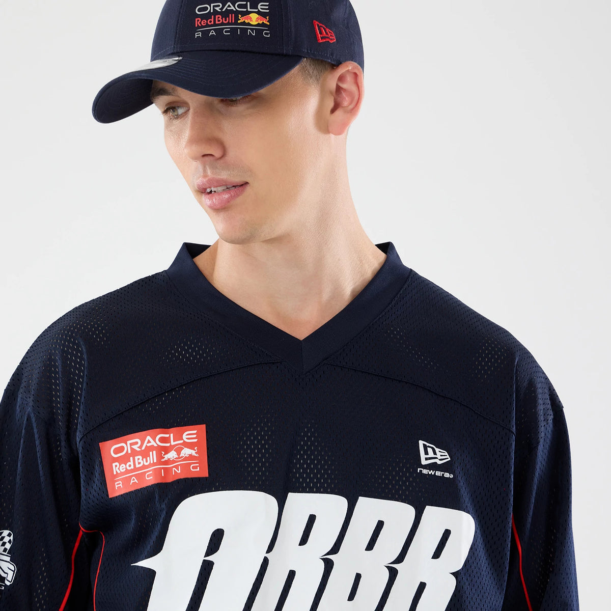 The model is wearing this Red Bull Racing Hockey Jersey in dark blue. 6