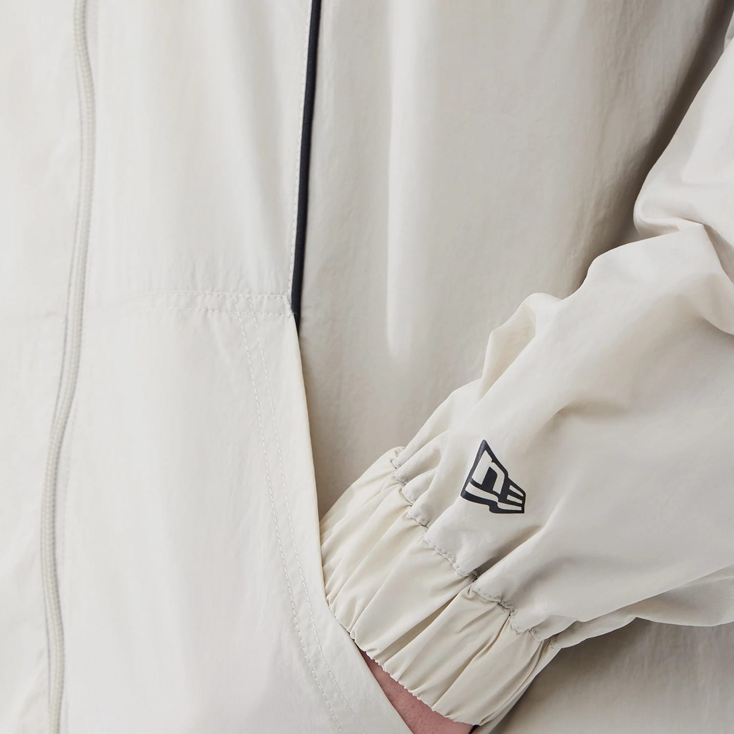 The model is wearing this MLB Piping New York Yankees Jacket in cream. 5
