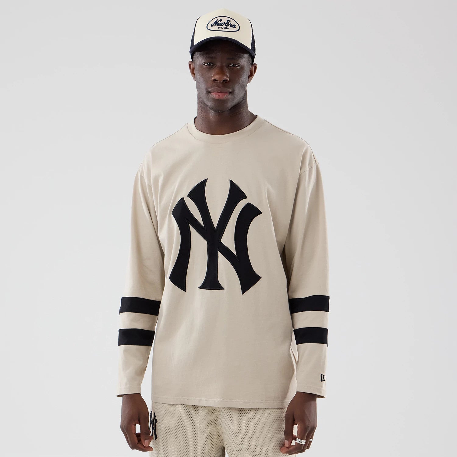 The model is wearing this MLB New York Yankees Oversized Long Sleeve T-Shirt in light beige. 1
