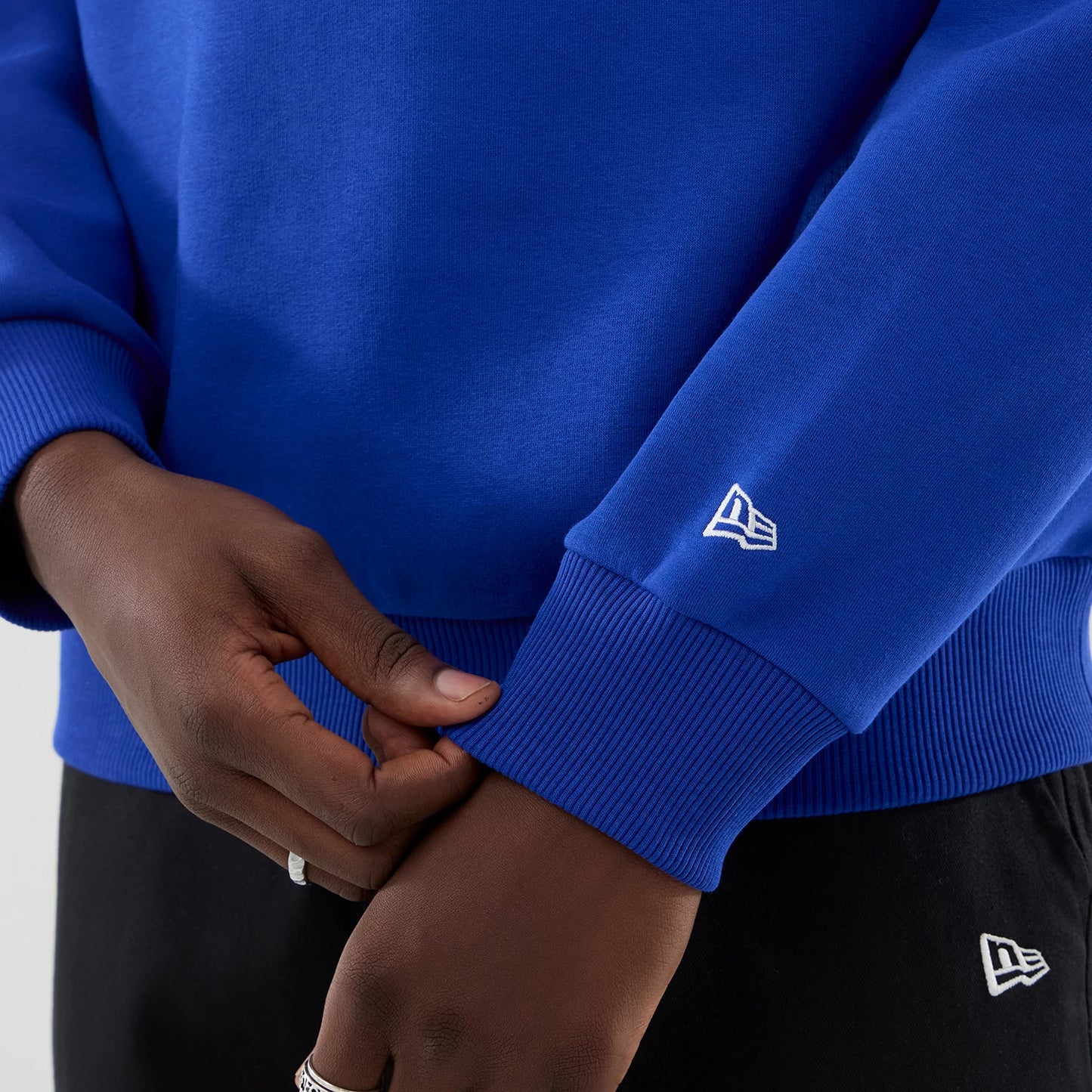 The model is wearing this Red Bull Racing Oversized Crew Neck Sweater in blue. 5