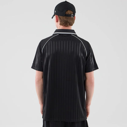 The model is wearing this New Era Football Jersey T-Shirt in black. 2