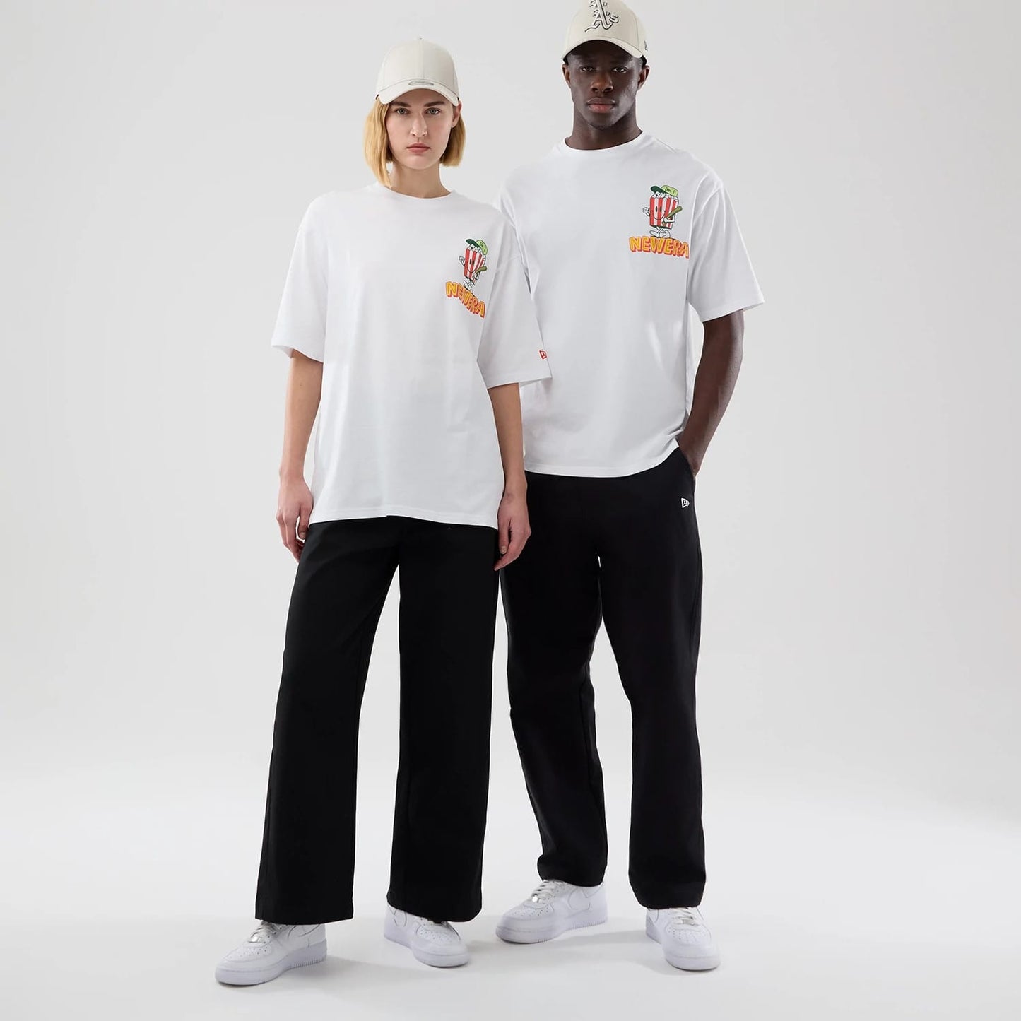 The model is wearing this New Era Food Graphic Oversized T-Shirt in white. 1
