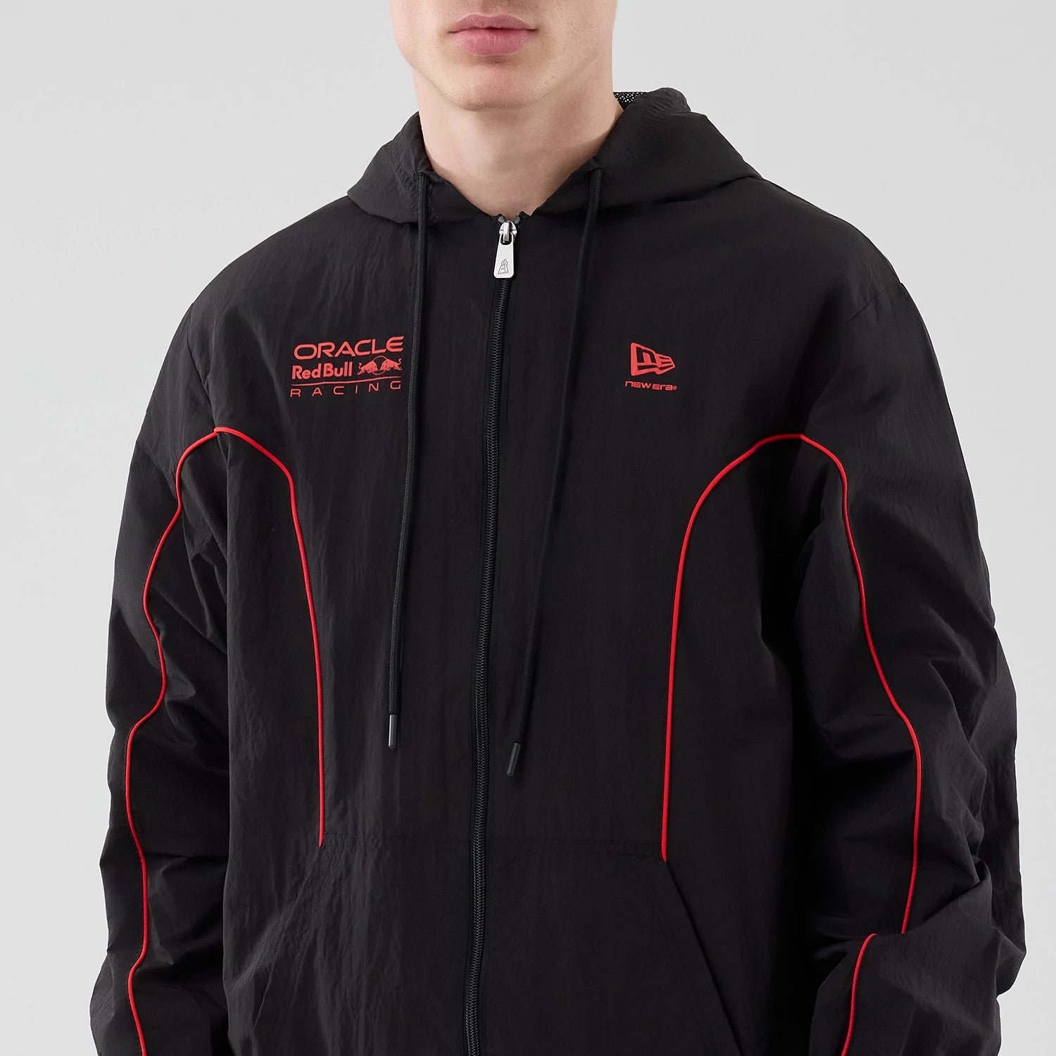 The model is wearing this Red Bull Racing Piping Track Jacket in black. 3