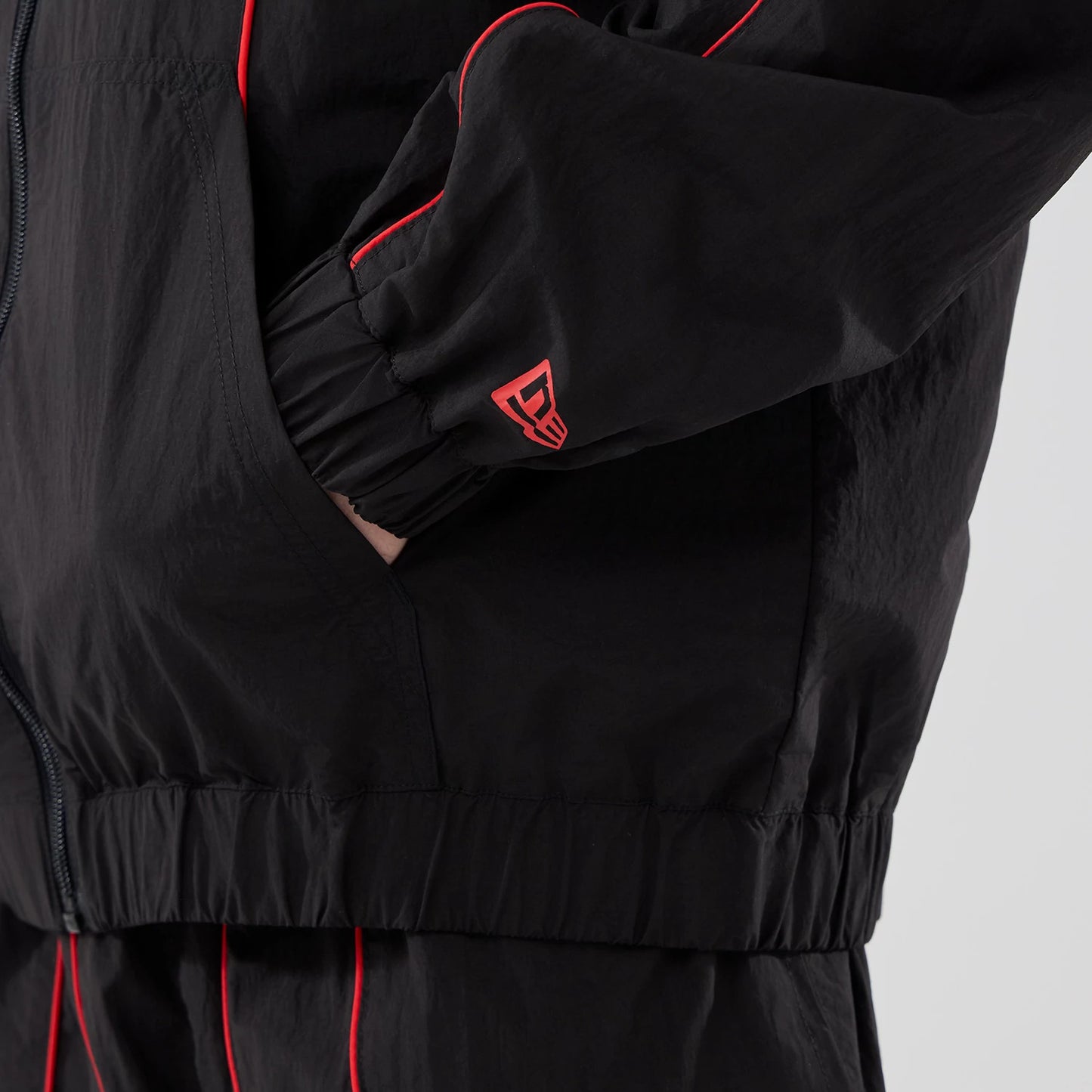The model is wearing this Red Bull Racing Piping Track Jacket in black. 5