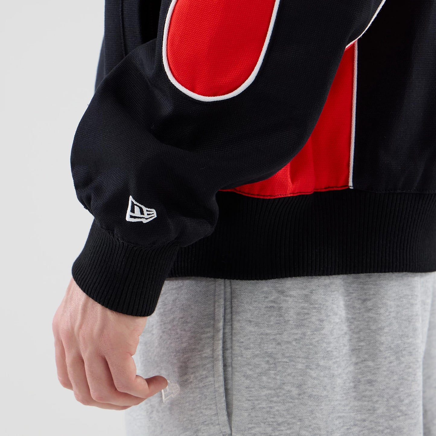 The model is wearing this Red Bull Racing Motorsport Jacket in black. 5