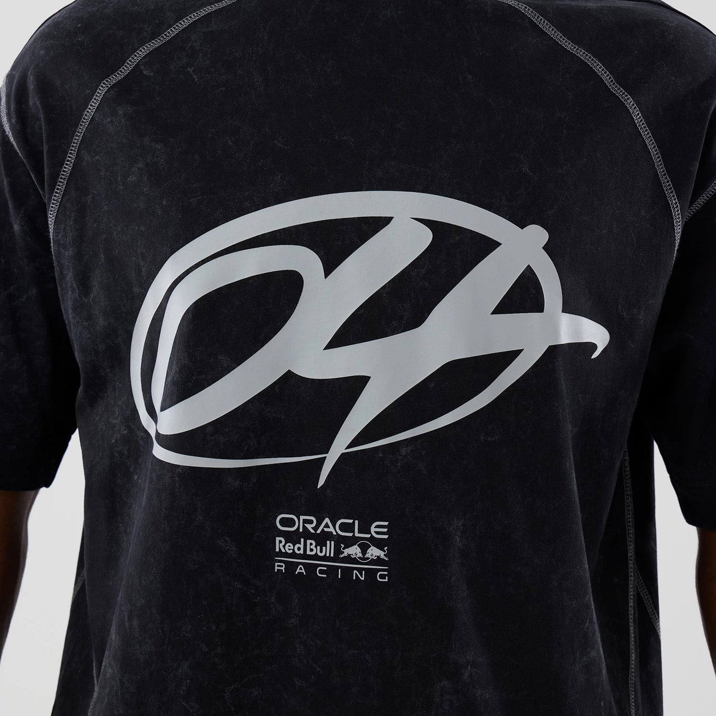 The model is wearing this Red Bull Racing Drop Shoulder T-Shirt in black. 4