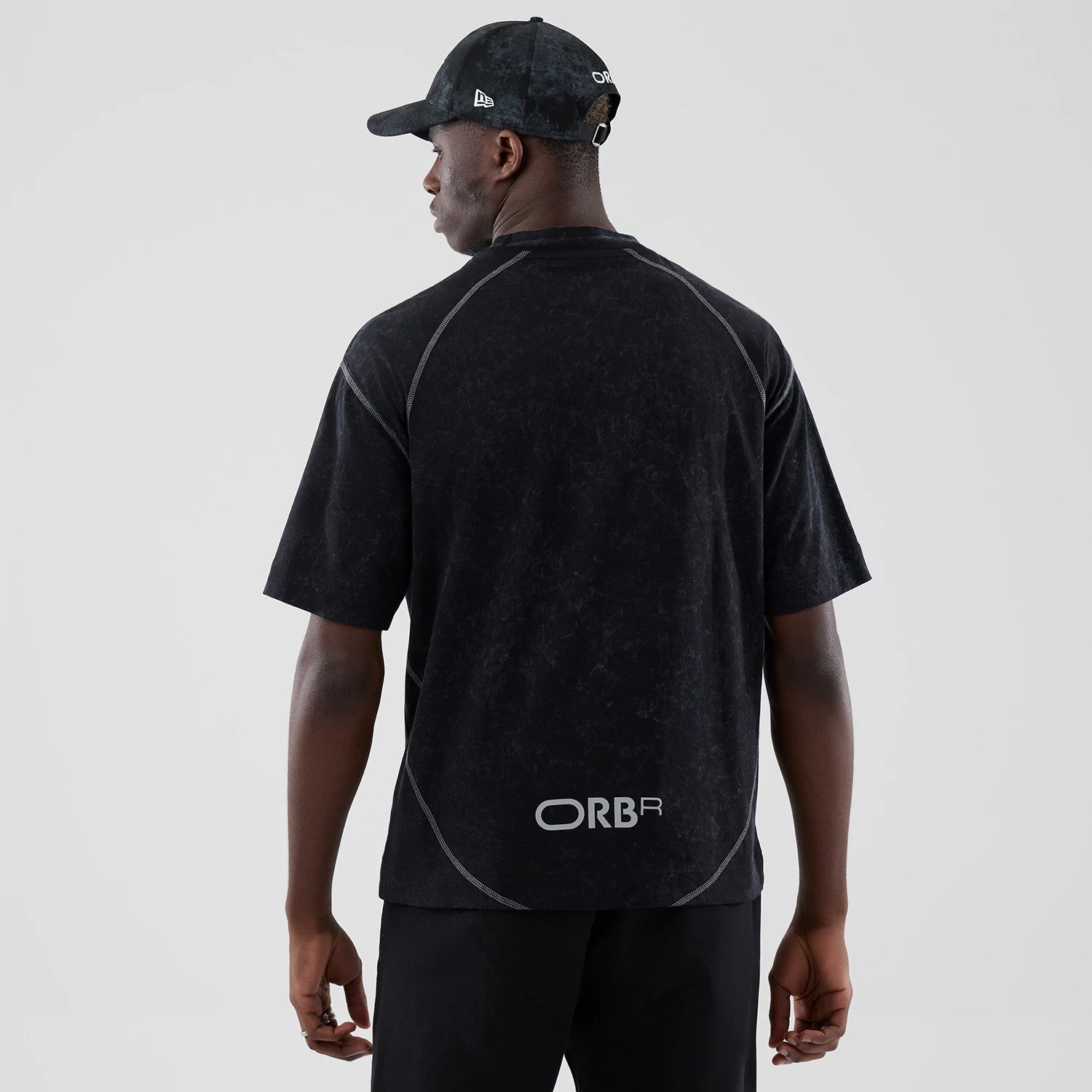 The model is wearing this Red Bull Racing Drop Shoulder T-Shirt in black. 2
