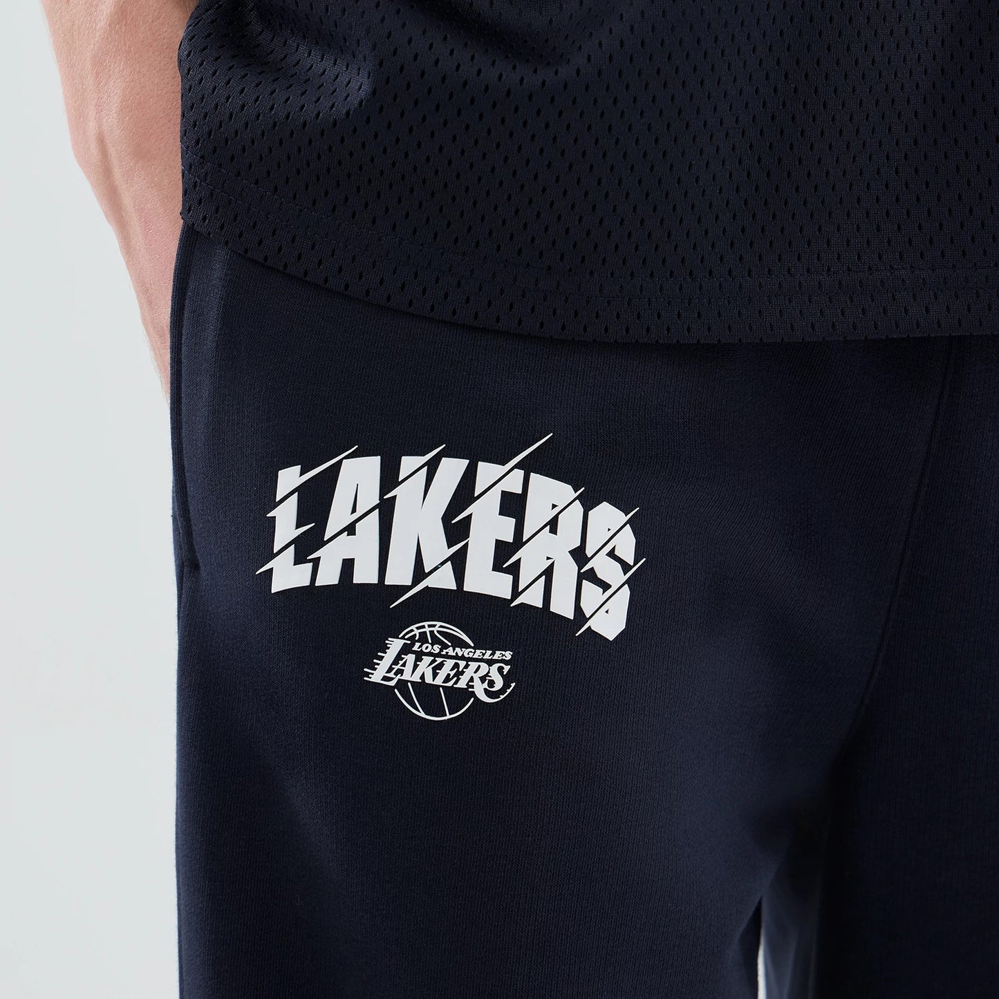 The model is wearing these NBA Core Plus LA Lakers Straight Leg Joggers in navy. 4