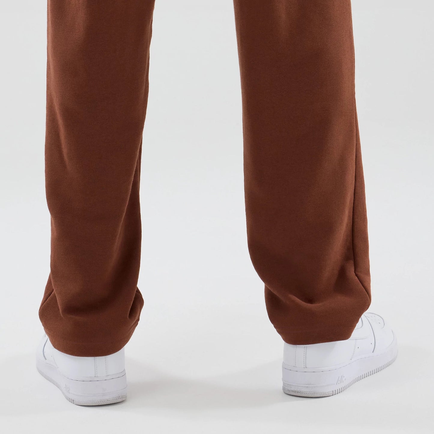 The model is wearing these NBA Core Plus Chicago Bulls Straight Leg Joggers in brown. 7
