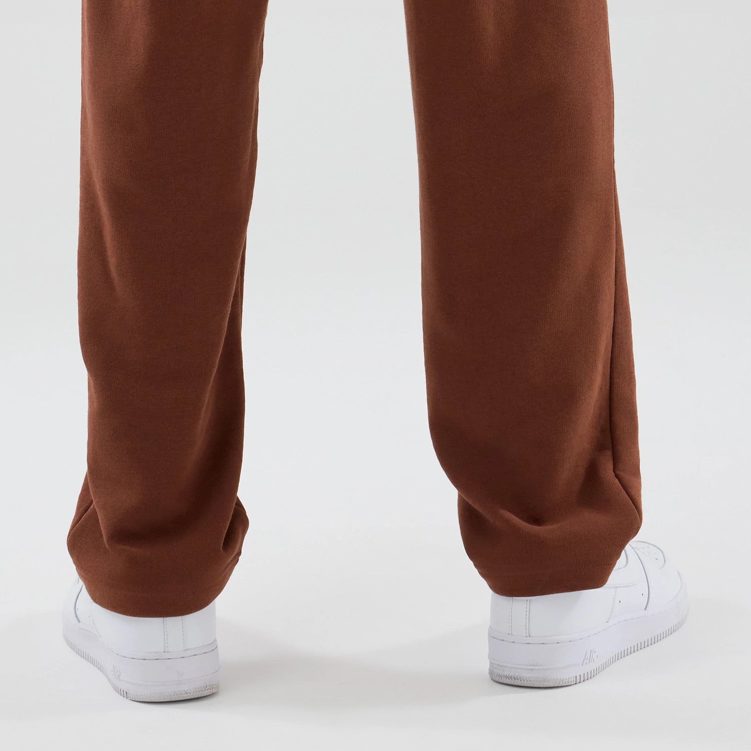 The model is wearing these NBA Core Plus Chicago Bulls Straight Leg Joggers in brown. 7