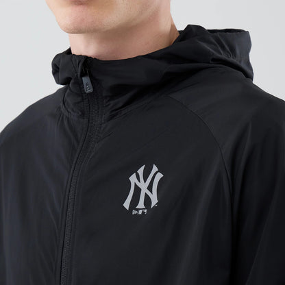 The model is wearing this MLB Core Plus Windbreaker New York Yankees Jacket in black. 4