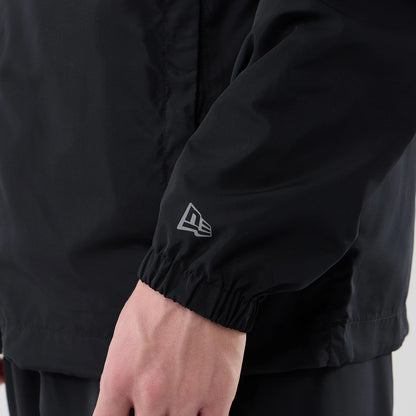 The model is wearing this MLB Core Plus Windbreaker New York Yankees Jacket in black. 5