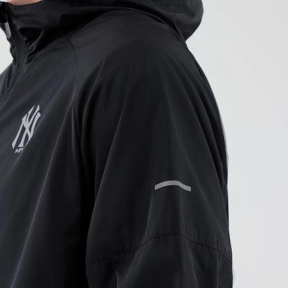 The model is wearing this MLB Core Plus Windbreaker New York Yankees Jacket in black. 6