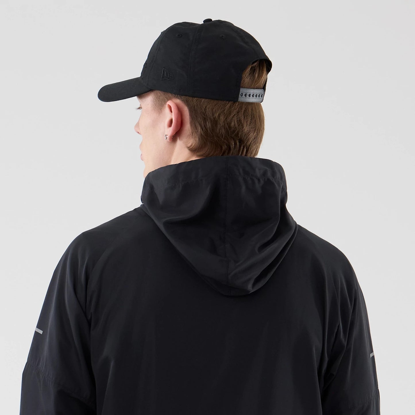 The model is wearing this MLB Core Plus Windbreaker New York Yankees Jacket in black. 7
