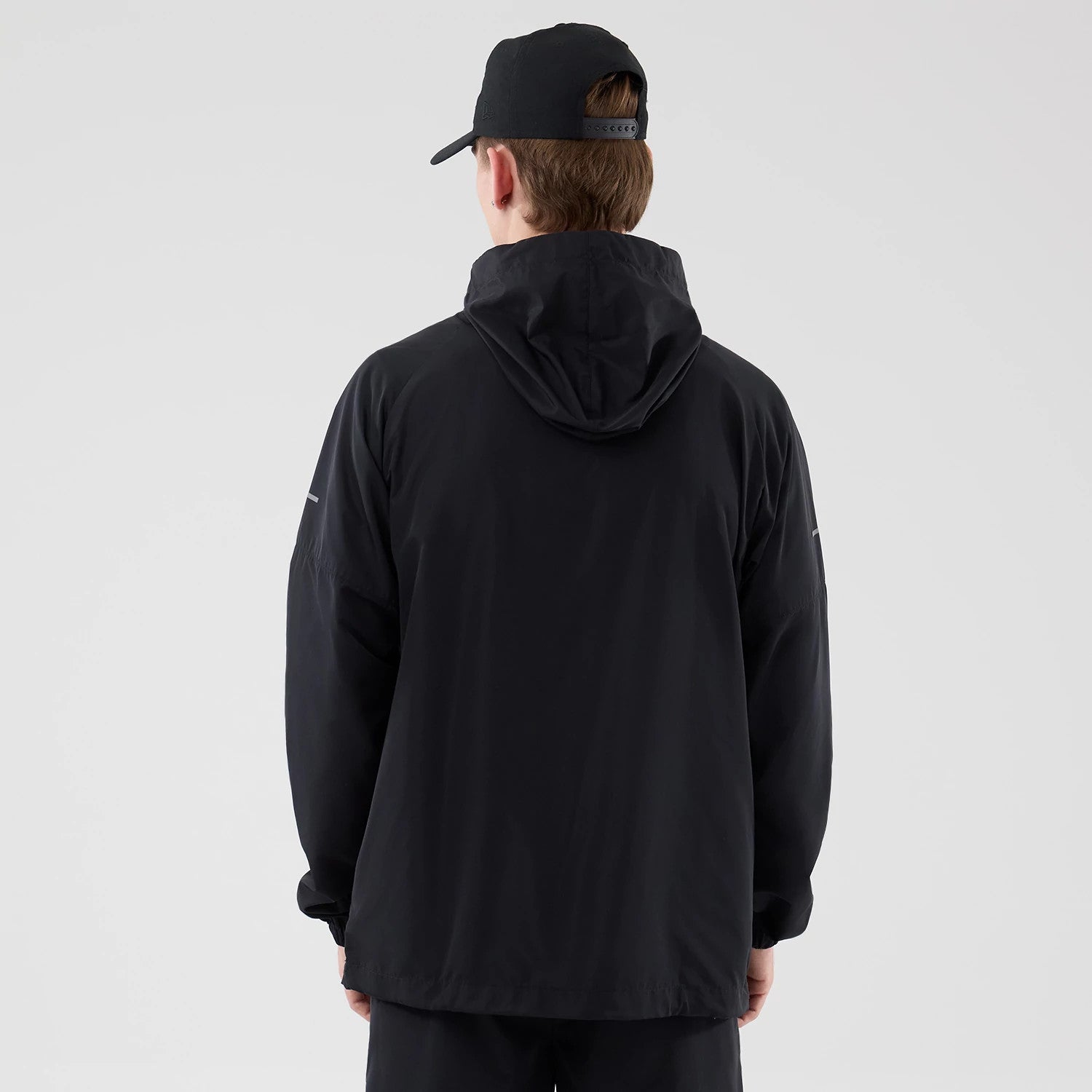 The model is wearing this MLB Core Plus Windbreaker New York Yankees Jacket in black. 2