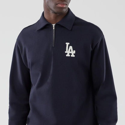 The model is wearing this MLB LA Dodgers Oversized 1/4 Zip Sweater in navy. 3