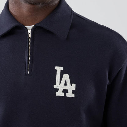 The model is wearing this MLB LA Dodgers Oversized 1/4 Zip Sweater in navy. 4