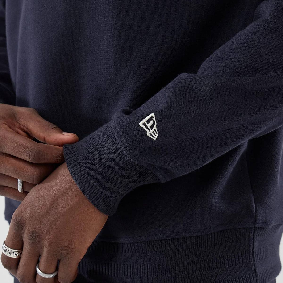 The model is wearing this MLB LA Dodgers Oversized 1/4 Zip Sweater in navy. 5