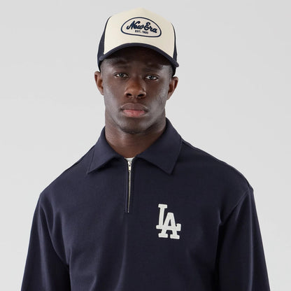 The model is wearing this MLB LA Dodgers Oversized 1/4 Zip Sweater in navy. 6