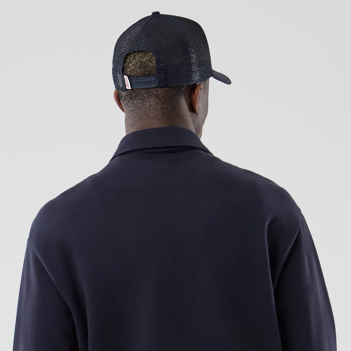 The model is wearing this MLB LA Dodgers Oversized 1/4 Zip Sweater in navy. 7