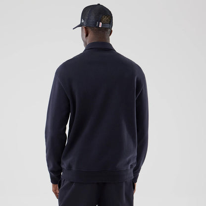 The model is wearing this MLB LA Dodgers Oversized 1/4 Zip Sweater in navy. 2