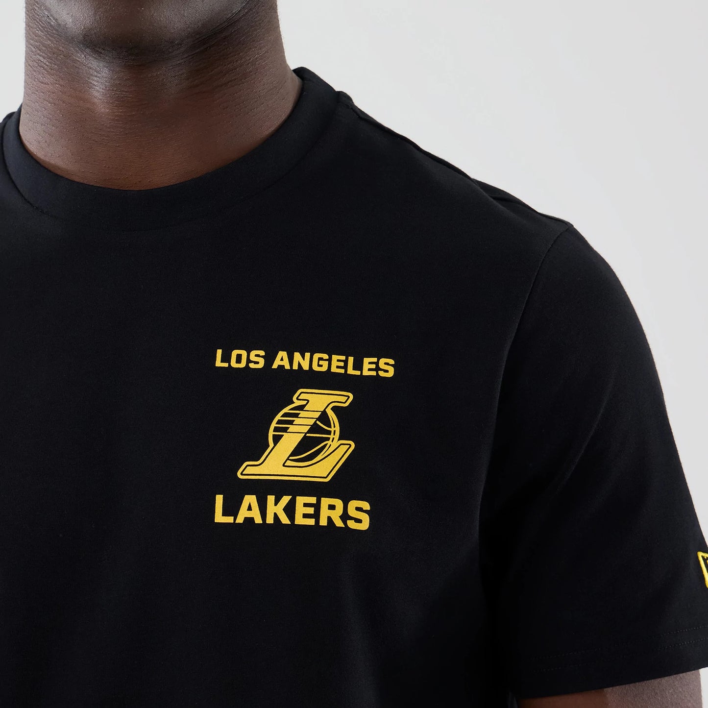 The model is wearing this NBA Court Graphic LA Lakers T-Shirt in black. 5