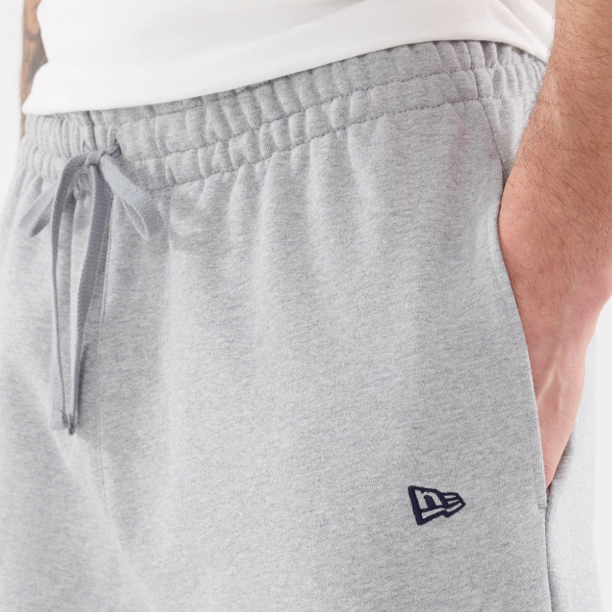 The model is wearing these MLB Straight Leg New York Yankees Straight Leg Joggers in grey. 4