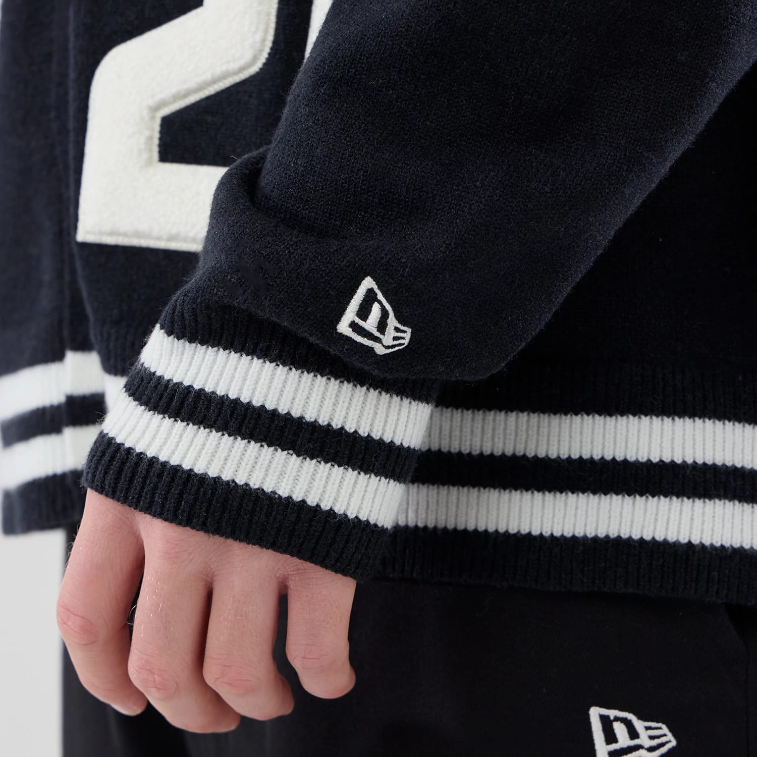 The model is wearing this New Era Heritage Cardigan in navy. 7