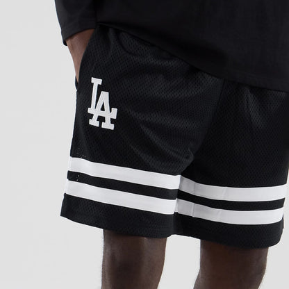 The model is wearing these MLB Mesh LA Dodgers Oversized Shorts in black. 3