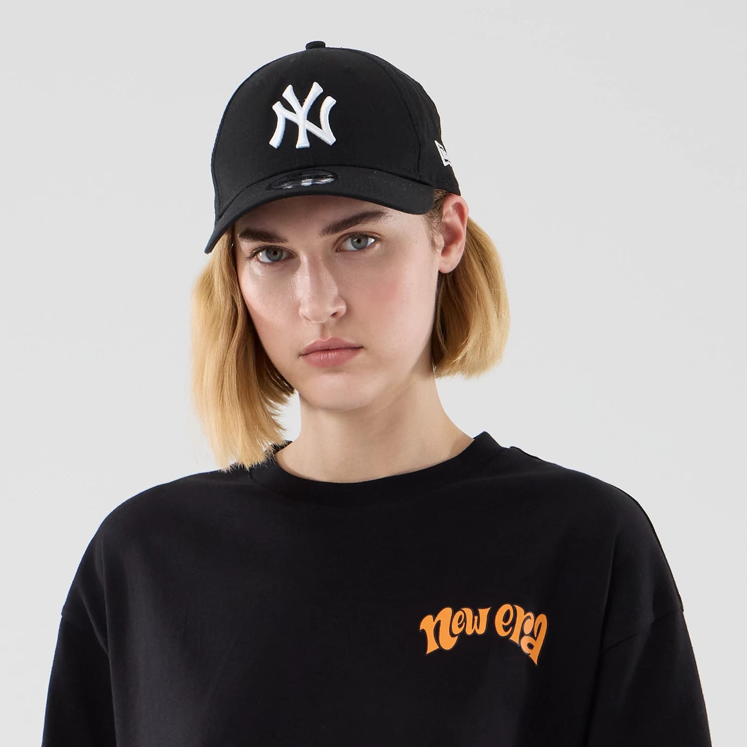 The model is wearing this New Era Food Graphic Oversized T-Shirt in black. 6