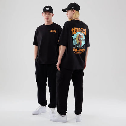 The model is wearing this New Era Food Graphic Oversized T-Shirt in black. 1