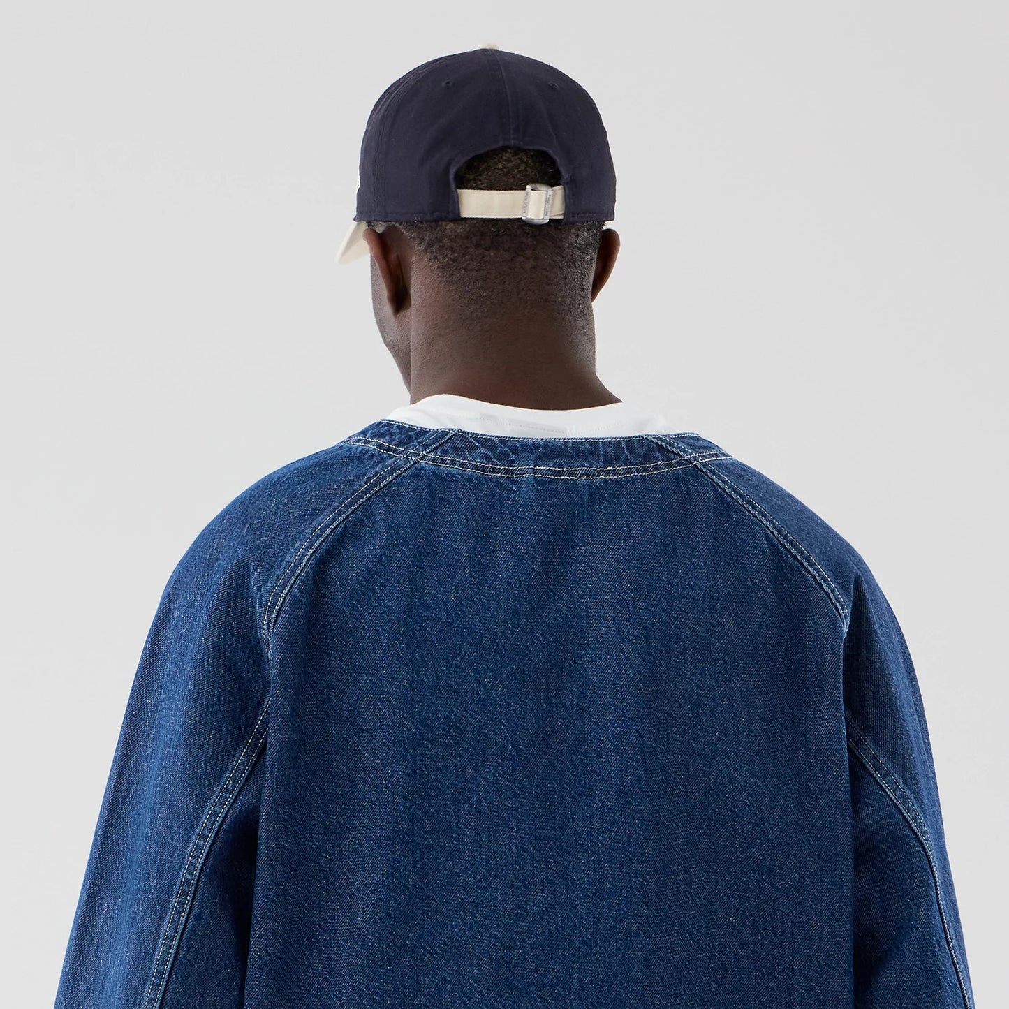 The model is wearing this New Era Denim Worker Jacket in dark blue. 7