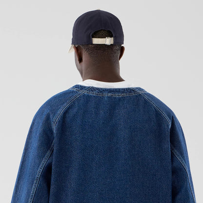 The model is wearing this New Era Denim Worker Jacket in dark blue. 7