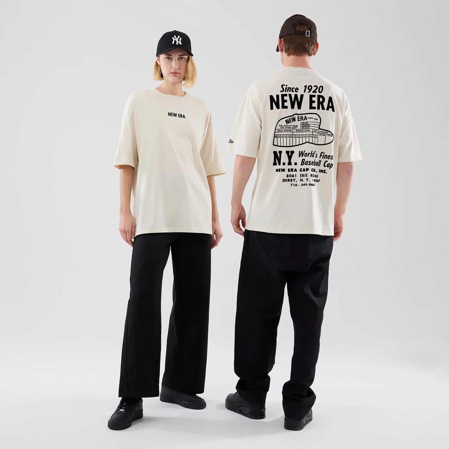 The model is wearing this New Era Cap Graphic Oversized T-Shirt in cream. 1