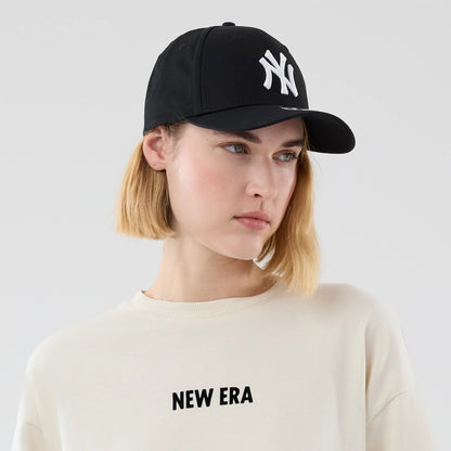 The model is wearing this New Era Cap Graphic Oversized T-Shirt in cream. 6