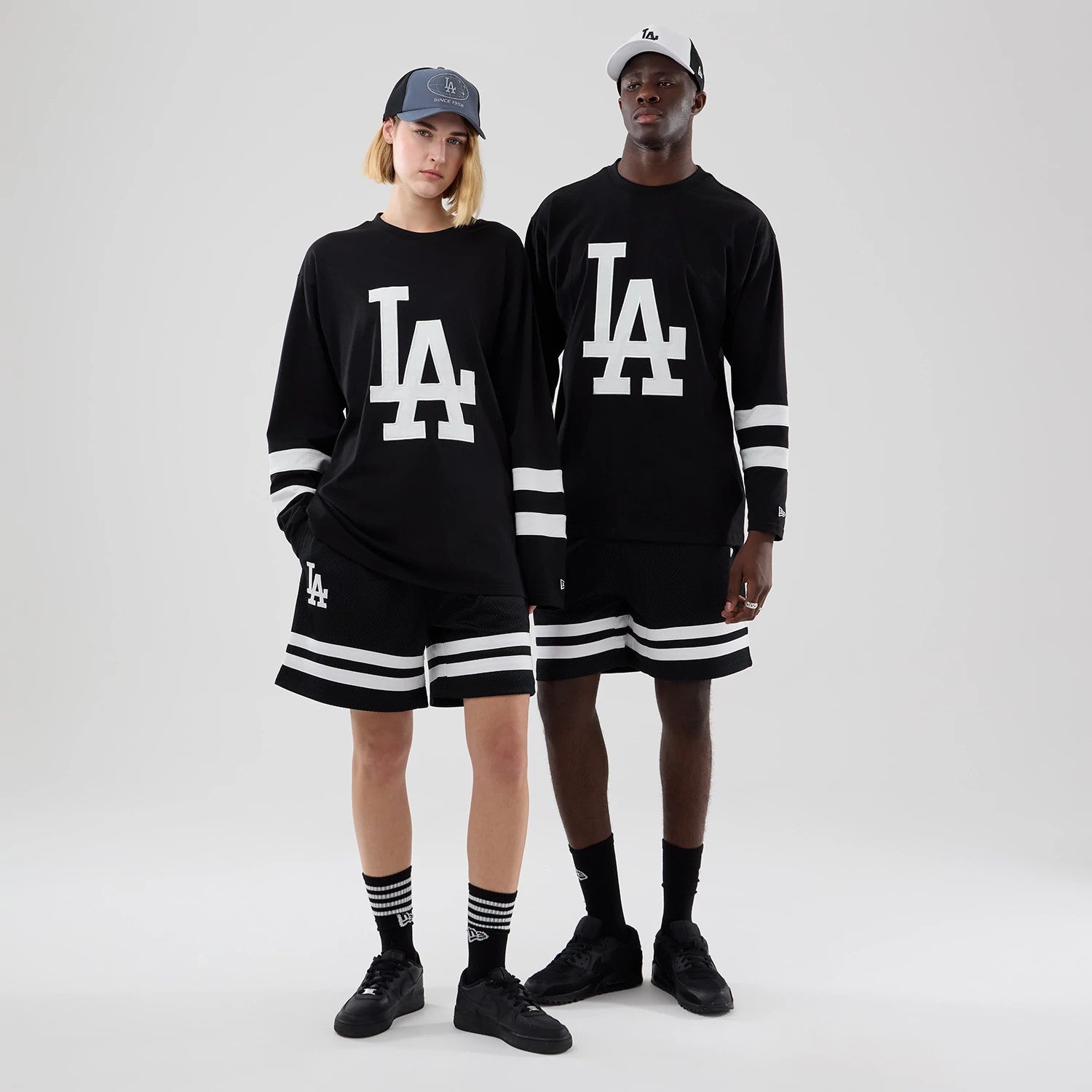 The model is wearing this MLB LA Dodgers Oversized Long Sleeve T-Shirt in black. 1