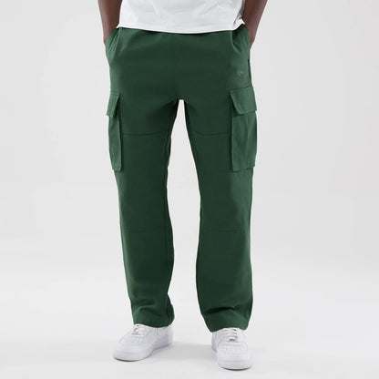 The model is wearing these New Era Cargo Trousers in dark green. 1