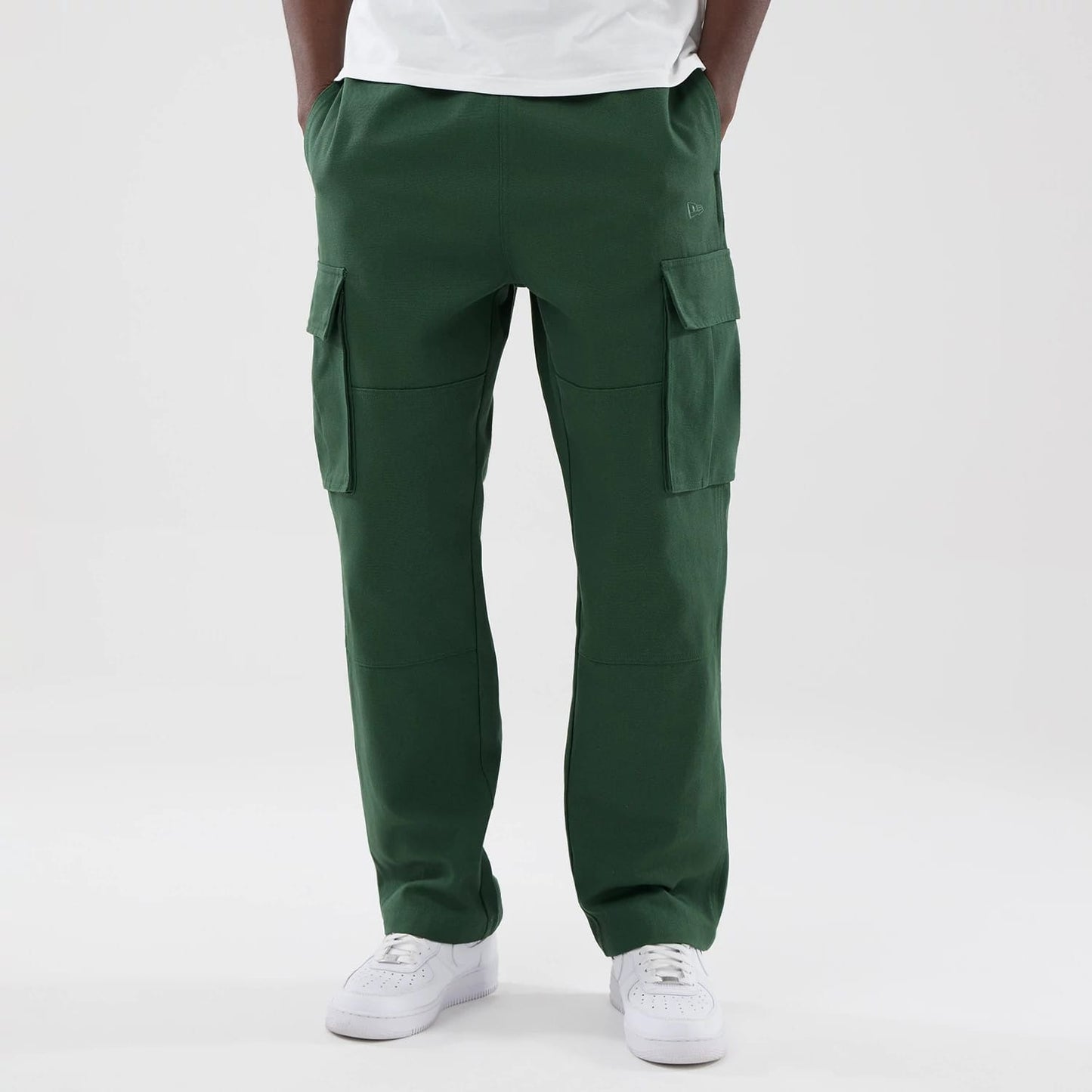 The model is wearing these New Era Cargo Trousers in dark green. 1